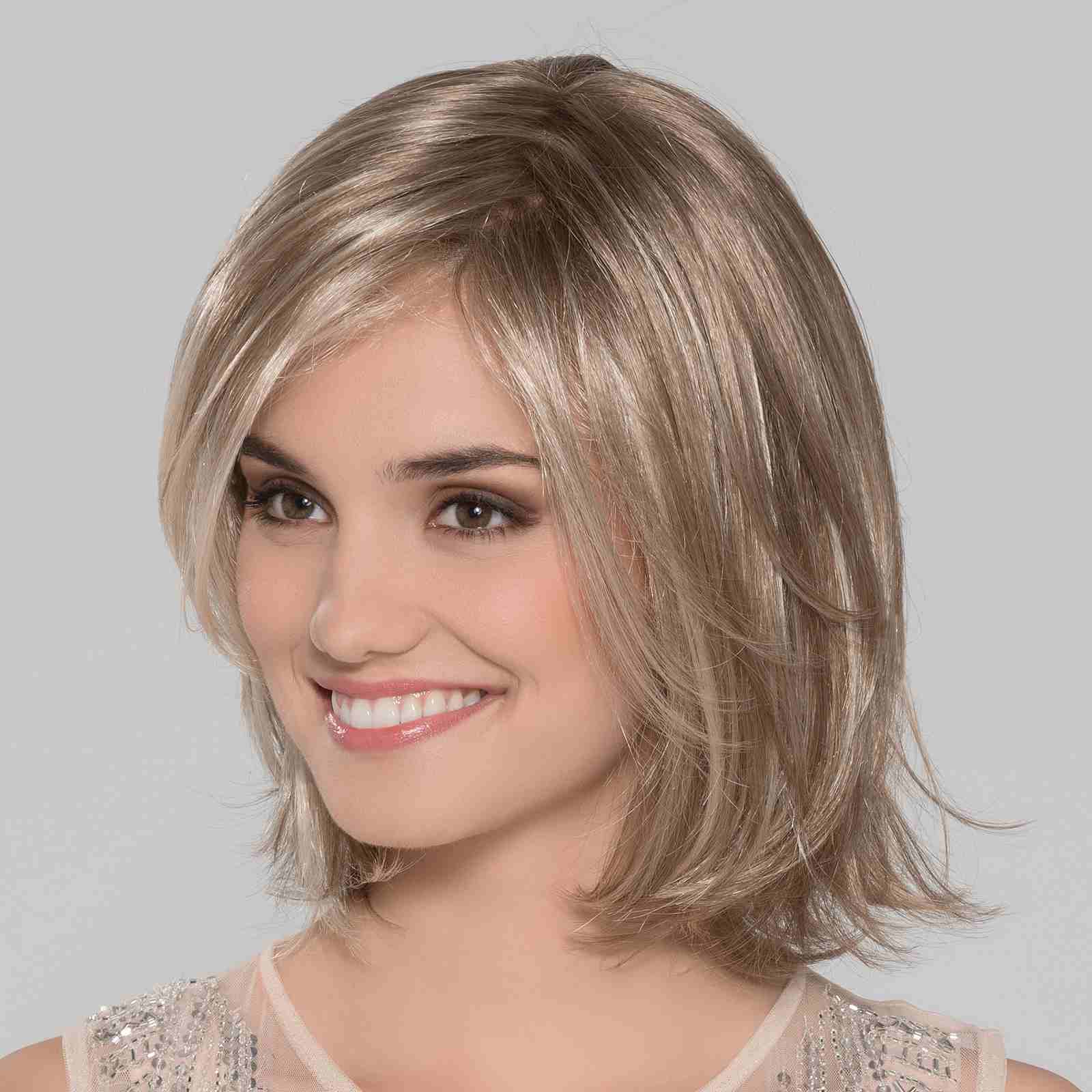Super lightweight and ready to wear wig. She has long layers throughout and hit's perfect at the shoulders Super lightweight and ready to wear wig. She has long layers throughout and hit's perfect at the shoulders