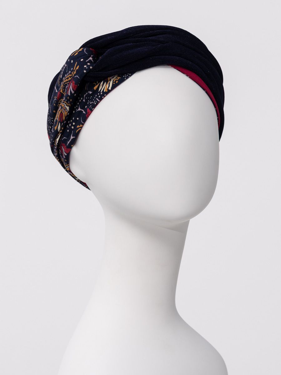 HocNoya Turban – Boho Glamour with a Touch of Sparkle A little boho. A little sparkle. A whole lot of style. The HocNoya Turban by Christine Headwear brings effortless boho glamour to your wardrobe. Designed with beautiful volume, rich texture and thoughtful details, it takes the classic bamboo turban to a whole new level. The look starts with a soft, comfortable single-layer turban base, inspired by the popular HocShakti. Then comes the fun part: two stylish headbands layered together to create a beautifully sculpted look. The first features a gorgeous printed bamboo fabric, while the second adds a subtle shimmer in a coordinating colour. At the front, the two double bands loop together to create an eye-catching knot effect, adding dimension and a touch of glamour. Simply place the base turban, add headband no. 1, then finish with the shimmering headband. In just a few easy steps, you can build your own look with extra volume and sparkle. Perfect with relaxed denim for a boho-chic daytime look or dressed up for an evening out, HocNoya is more than a head covering—it’s a beautiful fashion accessory designed to make you feel fabulous. Layer it. Add the sparkle. Own the look. HocNoya Turban – Boho Glamour with a Touch of Sparkle A little boho. A little sparkle. A whole lot of style. The HocNoya Turban by Christine Headwear brings effortless boho glamour to your wardrobe. Designed with beautiful volume, rich texture and thoughtful details, it takes the classic bamboo turban to a whole new level. The look starts with a soft, comfortable single-layer turban base, inspired by the popular HocShakti. Then comes the fun part: two stylish headbands layered together to create a beautifully sculpted look. The first features a gorgeous printed bamboo fabric, while the second adds a subtle shimmer in a coordinating colour. At the front, the two double bands loop together to create an eye-catching knot effect, adding dimension and a touch of glamour. Simply place the base turban, add headband no. 1, then finish with the shimmering headband. In just a few easy steps, you can build your own look with extra volume and sparkle. Perfect with relaxed denim for a boho-chic daytime look or dressed up for an evening out, HocNoya is more than a head covering—it’s a beautiful fashion accessory designed to make you feel fabulous. Layer it. Add the sparkle. Own the look.