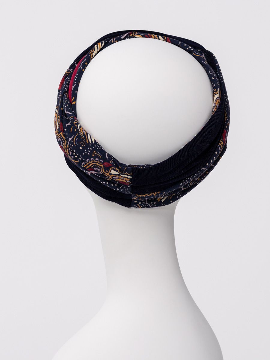 HocNoya Turban – Boho Glamour with a Touch of Sparkle A little boho. A little sparkle. A whole lot of style. The HocNoya Turban by Christine Headwear brings effortless boho glamour to your wardrobe. Designed with beautiful volume, rich texture and thoughtful details, it takes the classic bamboo turban to a whole new level. The look starts with a soft, comfortable single-layer turban base, inspired by the popular HocShakti. Then comes the fun part: two stylish headbands layered together to create a beautifully sculpted look. The first features a gorgeous printed bamboo fabric, while the second adds a subtle shimmer in a coordinating colour. At the front, the two double bands loop together to create an eye-catching knot effect, adding dimension and a touch of glamour. Simply place the base turban, add headband no. 1, then finish with the shimmering headband. In just a few easy steps, you can build your own look with extra volume and sparkle. Perfect with relaxed denim for a boho-chic daytime look or dressed up for an evening out, HocNoya is more than a head covering—it’s a beautiful fashion accessory designed to make you feel fabulous. Layer it. Add the sparkle. Own the look. HocNoya Turban – Boho Glamour with a Touch of Sparkle A little boho. A little sparkle. A whole lot of style. The HocNoya Turban by Christine Headwear brings effortless boho glamour to your wardrobe. Designed with beautiful volume, rich texture and thoughtful details, it takes the classic bamboo turban to a whole new level. The look starts with a soft, comfortable single-layer turban base, inspired by the popular HocShakti. Then comes the fun part: two stylish headbands layered together to create a beautifully sculpted look. The first features a gorgeous printed bamboo fabric, while the second adds a subtle shimmer in a coordinating colour. At the front, the two double bands loop together to create an eye-catching knot effect, adding dimension and a touch of glamour. Simply place the base turban, add headband no. 1, then finish with the shimmering headband. In just a few easy steps, you can build your own look with extra volume and sparkle. Perfect with relaxed denim for a boho-chic daytime look or dressed up for an evening out, HocNoya is more than a head covering—it’s a beautiful fashion accessory designed to make you feel fabulous. Layer it. Add the sparkle. Own the look.